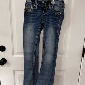 Rock Revival Blue Boot Cut Jeans with Vintage-Inspired Wash